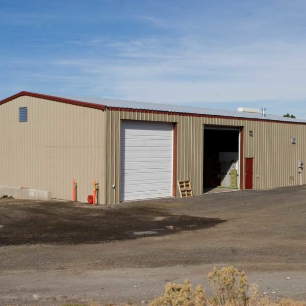 Tan 50x90 Workshop steel building located in Penticton, British Colombia, Canada